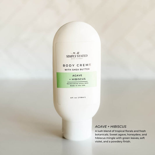 Simply Stated Bath & Body Agave + Hibiscus Body Crème with shea butter in a minimalist white bottle, featuring a soft green label and clean product photography on a white background.