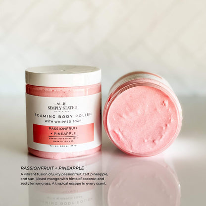 Simply Stated Foaming Body Polish in Passionfruit + Pineapple – bright pink whipped sugar scrub with juicy tropical fragrance, shown in open and closed jars.