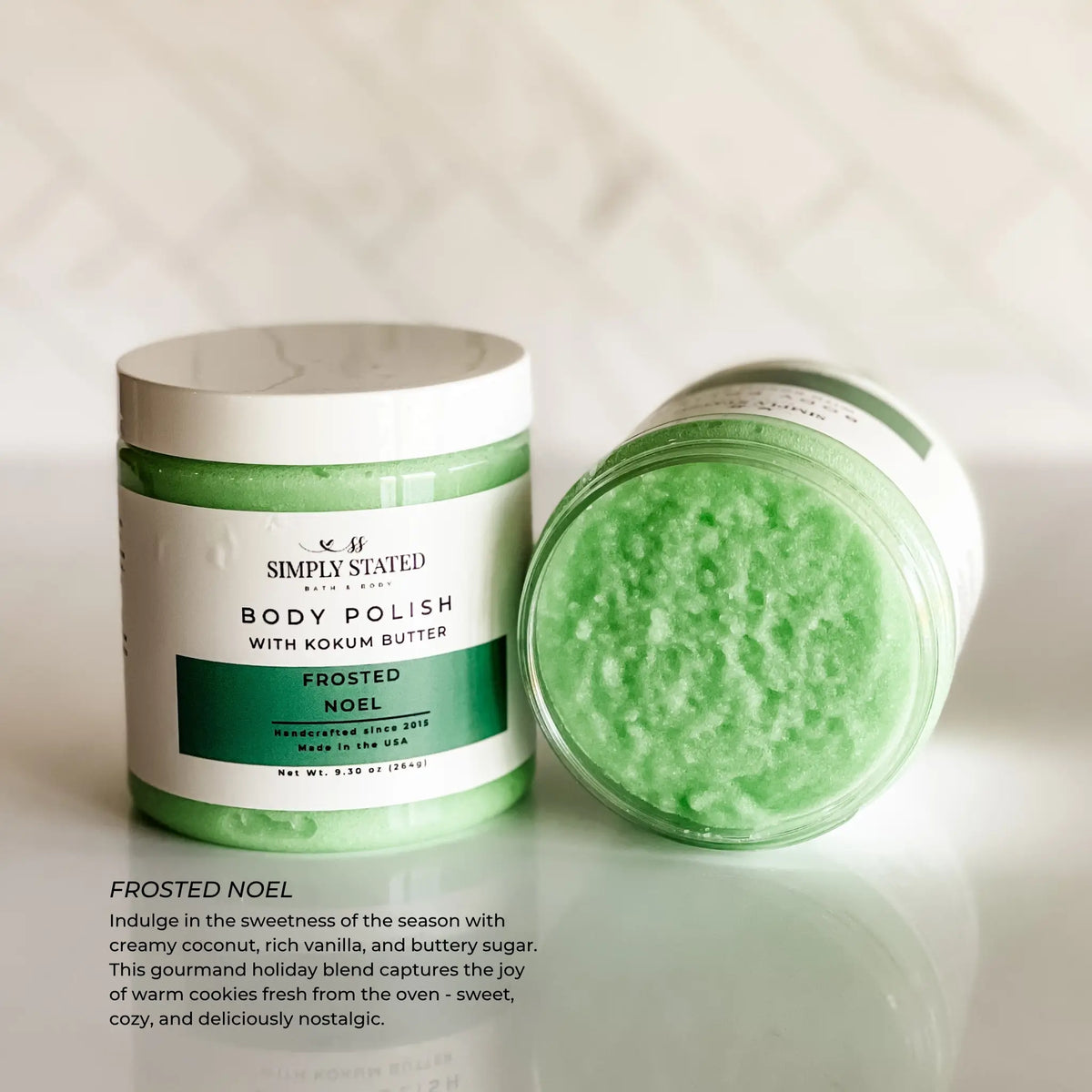 Simply Stated Frosted Noel Body Polish with kokum butter, coconut vanilla sugar scrub texture on marble surface.