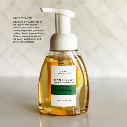 Simply Stated Frosted Noel Hand Soap with coconut oil, foaming pump bottle, coconut vanilla scent, on marble.