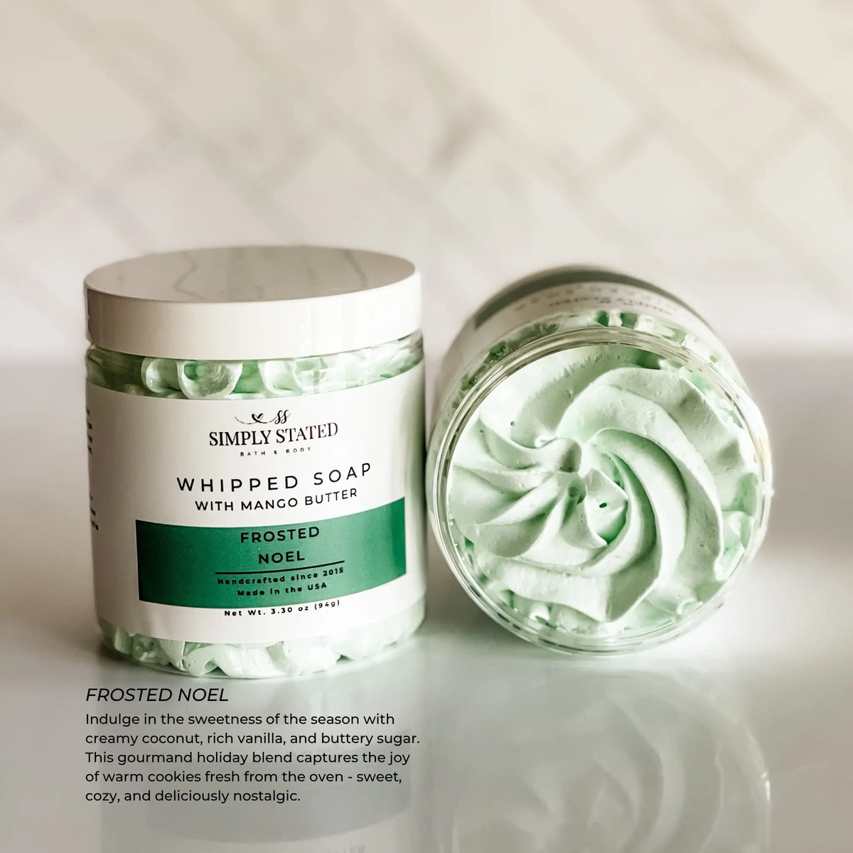 Simply Stated Frosted Noel Whipped Soap with mango butter, coconut vanilla scent, swirled lather on marble.