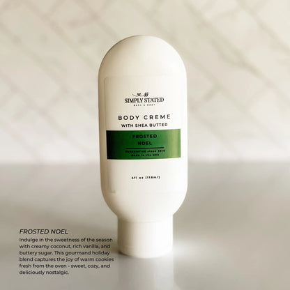 Simply Stated Frosted Noel Body Creme with shea butter, coconut vanilla holiday scent, on marble background.