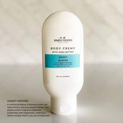 Simply Stated Sweet Winter Body Creme with shea butter, banana lemon peach scent, on marble background.