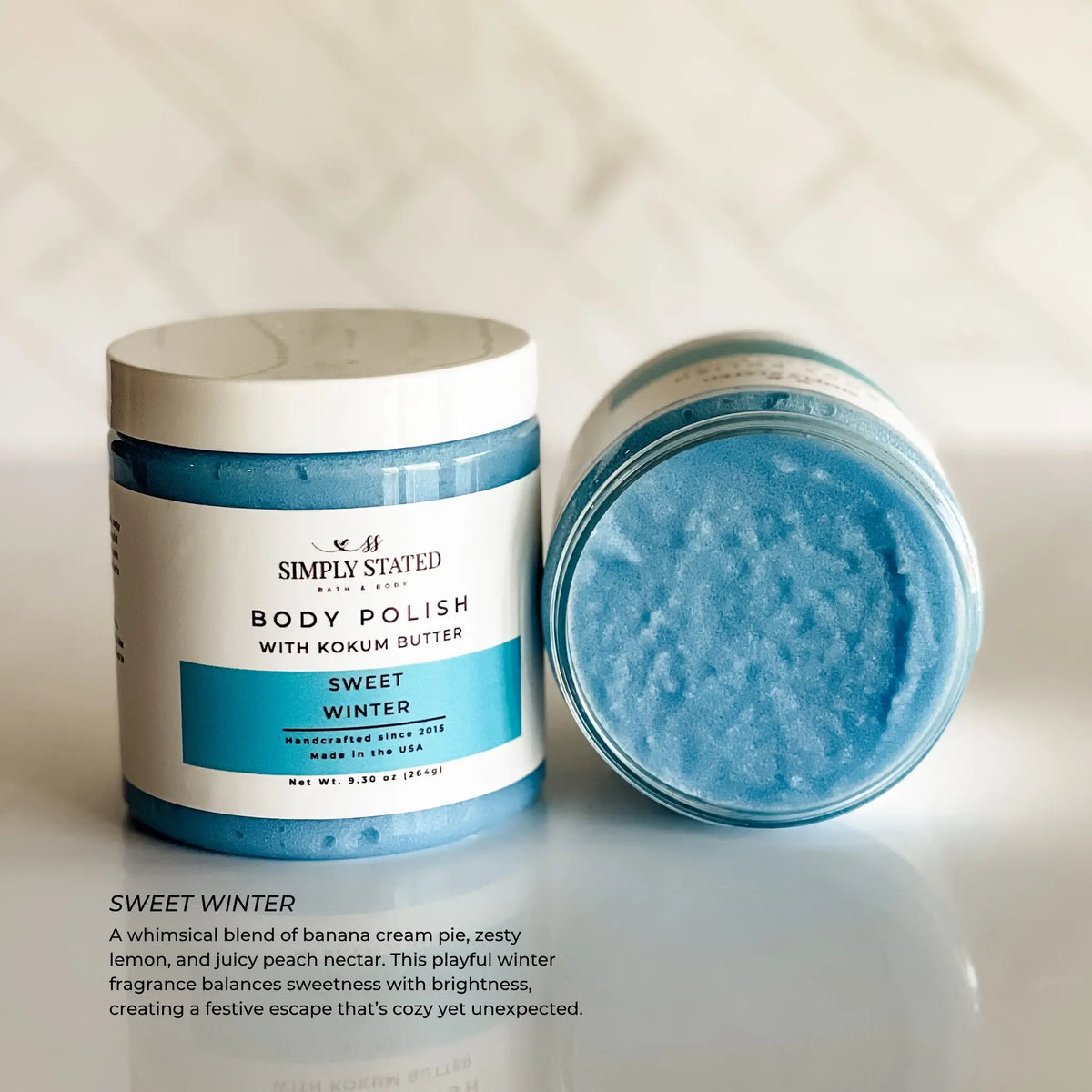Simply Stated Sweet Winter Body Polish with kokum butter, banana lemon peach scrub texture on marble surface.