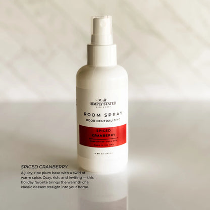 Simply Stated Spiced Cranberry Room Spray, odor neutralizing, juicy plum and warm spice scent, on marble.