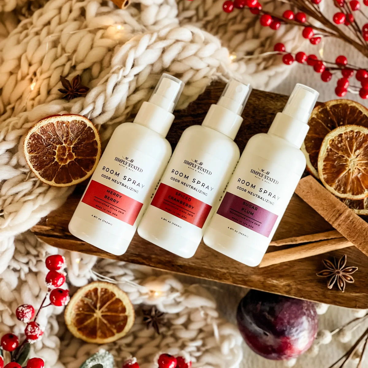 Simply Stated Room Spray trio, Merry Berry, Spiced Cranberry, Sugar Plum, with dried oranges, cinnamon, and knit.