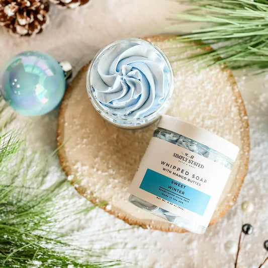 Simply Stated Sweet Winter Whipped Soap with mango butter, blue swirled lather styled with pine and ornaments.